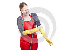 Woman cleaner wearing protective rubber gloves