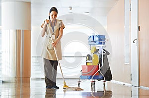 Woman cleaning building hall