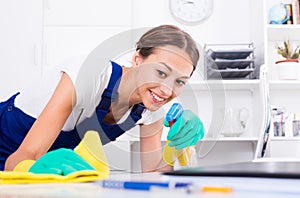 Woman cleaning in company office