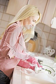 Woman Cleaning Dishes