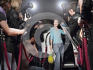 Woman With Cleaning Equipment Posing In Front Of Paparazzi