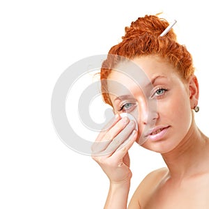 Woman cleaning face photo