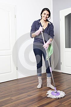 Woman cleaning the flat
