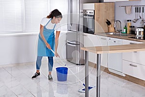 Woman Cleaning Floor With Mop