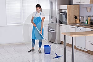 Woman Cleaning Floor With Mop