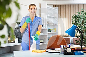 Woman cleaning floor with mop