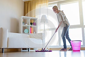 Woman cleaning floors at home