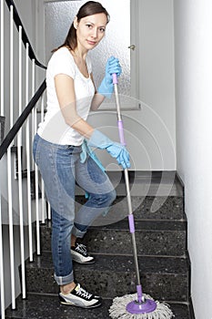 Woman cleaning the hall