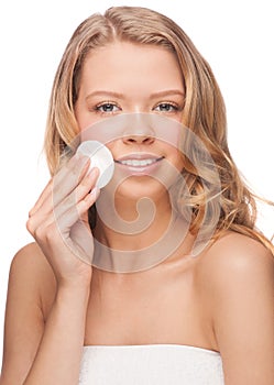 Woman cleaning her face