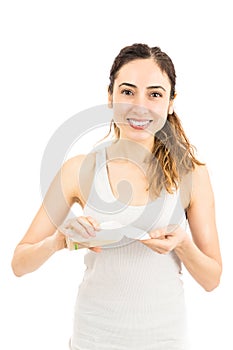 Woman cleaning her face with tonic cleanser