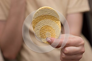 Woman cleaning her hands with a tissue