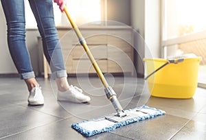 Woman cleaning her house