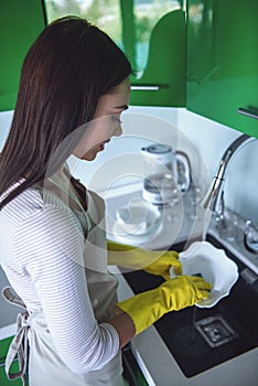 Woman cleaning her kitchen