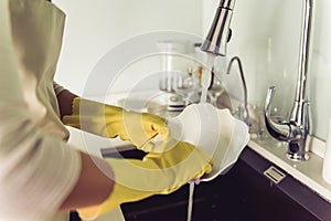 Woman cleaning her kitchen