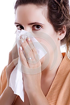 Woman cleaning her nose