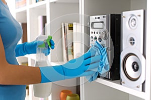 Woman cleaning at home with detergent