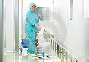 Woman cleaning hospital hall