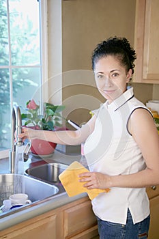Woman cleaning in the kitchen