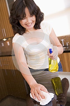 Woman Cleaning Kitchen Counter