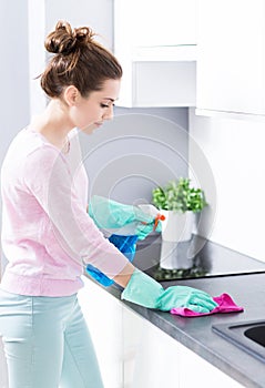 Woman cleaning kitchen