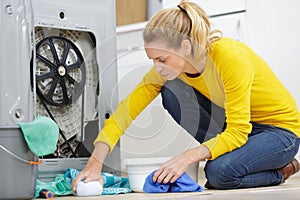 woman cleaning leak