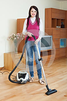 Woman cleaning living room