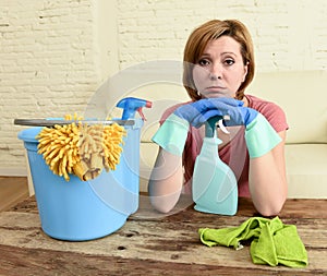 Woman cleaning living room table with cloth and spray bottle tired in stress
