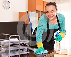 Woman cleaning office room