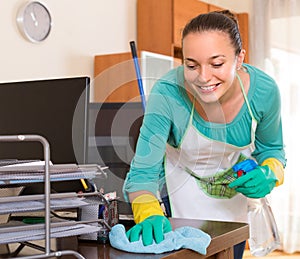Woman cleaning office room