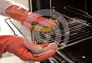 Woman cleaning oven