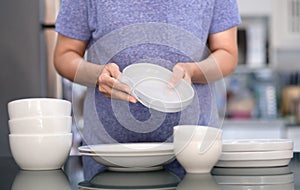 Woman Cleaning product concept wiping dishware cleaner in home a