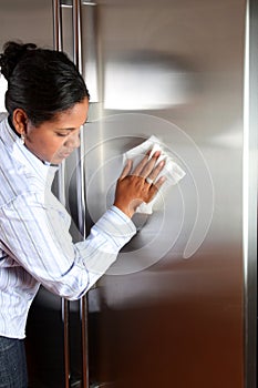 Woman Cleaning Refrigerator