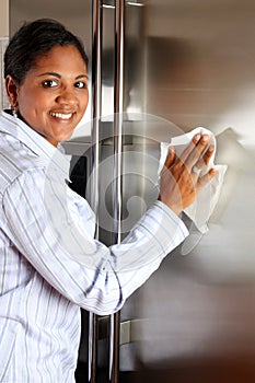 Woman Cleaning Refrigerator