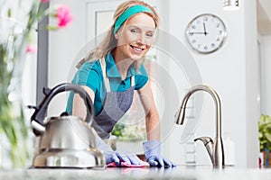 Woman cleaning in rubber gloves