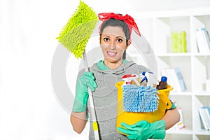 Woman with cleaning supplies in the living room