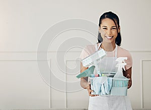 Woman, cleaning supplies and smile in portrait, chemical spray and hygiene with household maintenance product. Happy