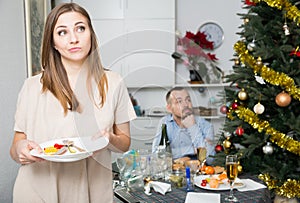 Woman cleaning table after dinner