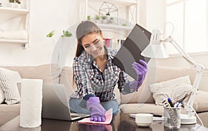 Woman cleaning table lamp copy space