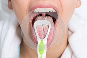 Woman Cleaning Tongue