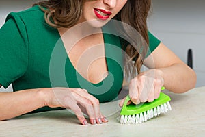 Woman cleaning up her kitchen