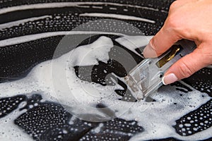 A woman cleans the electronic ceramic hob