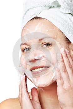 Woman clears a face skin foam