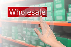 Woman clicking Wholesale button and view of warehouse on background