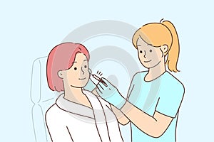 Woman client get face procedures in beauty salon