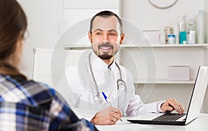 Woman client visiting consultation with man doctor