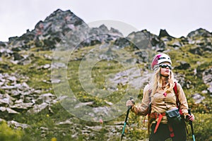 Woman climber hiking at rocky mountains