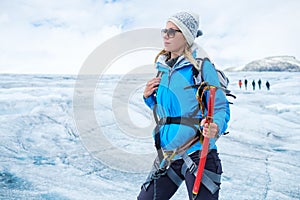 Woman climber standing on Jostedalsbreen glacier.
