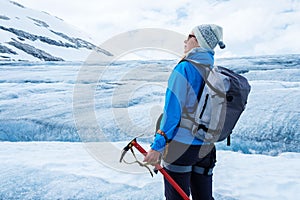 Woman climber standing on Jostedalsbreen glacier.