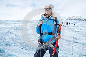 Woman climber standing on Jostedalsbreen glacier.