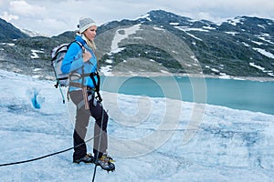 Woman climber standing on Jostedalsbreen glacier.